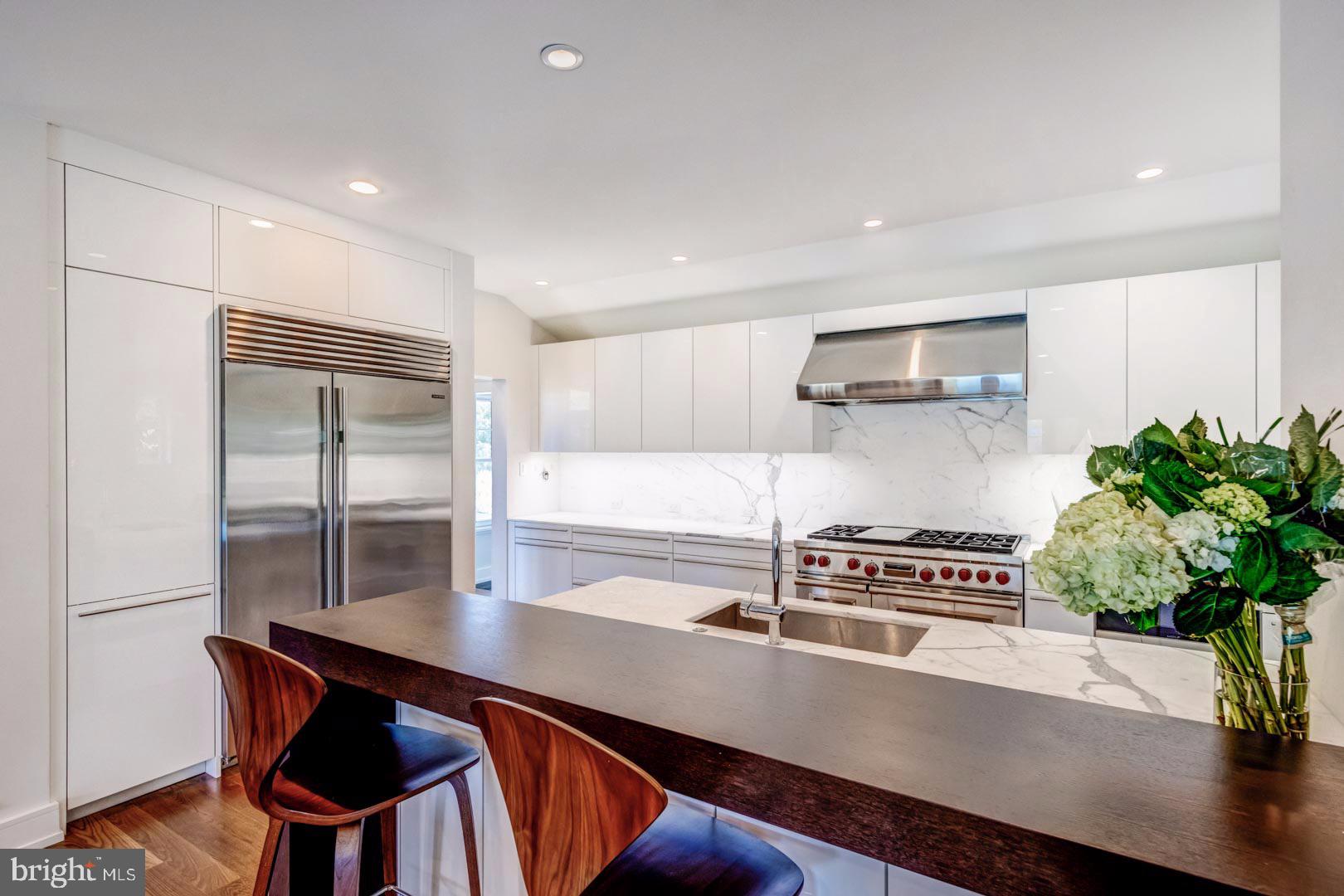 609 St Andrews Road Philadelphia, PA 19118 - Photo 10 of 31 a hallway with a table and a potted plant