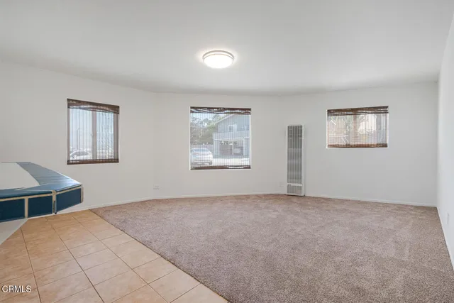 a view of empty room with windows