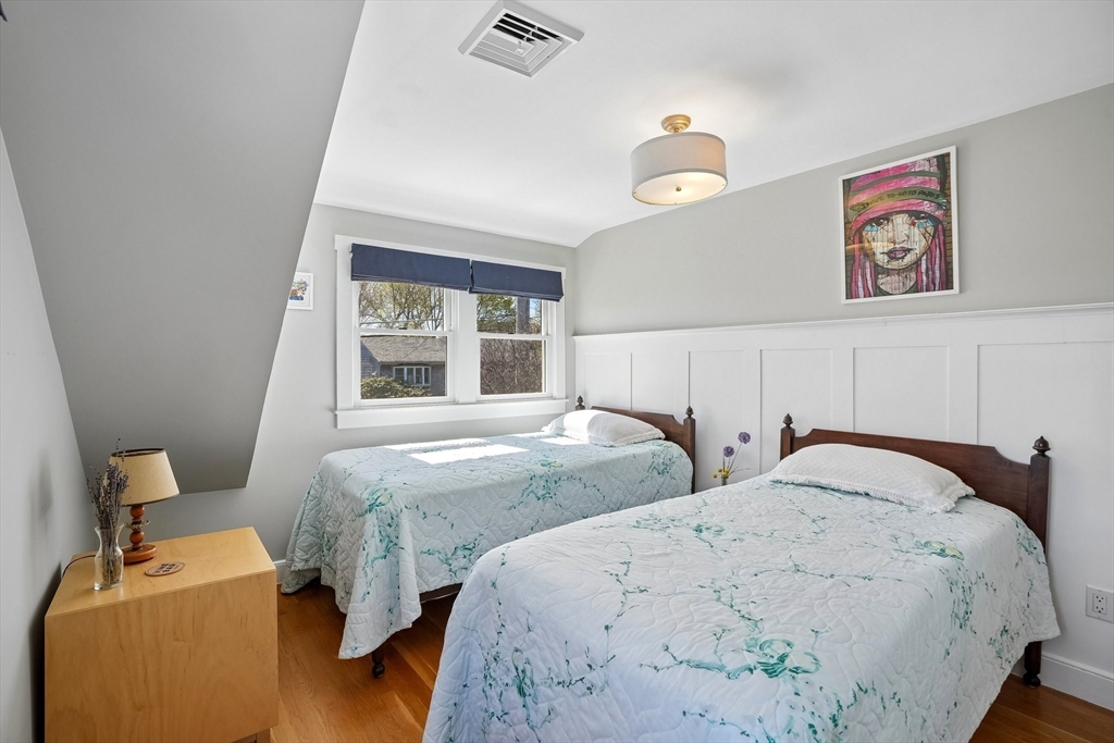 12 Hawley Road Scituate, MA 02066 - Photo 10 of 24 a bedroom with two beds and a window