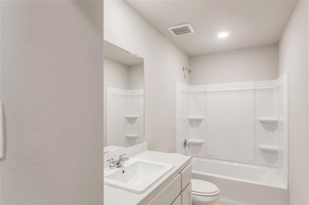 3137 Pecan Farm Lane Fort Worth, TX 76140 - Photo 9 of 31 a bathroom with a sink a toilet and shower