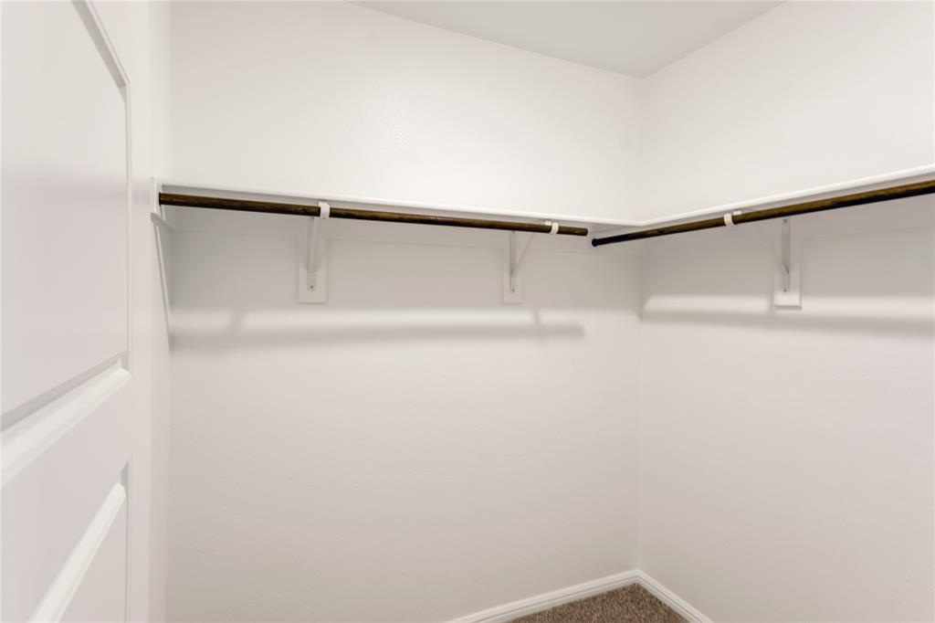 3137 Pecan Farm Lane Fort Worth, TX 76140 - Photo 16 of 31 a view of small space with racks on the wall