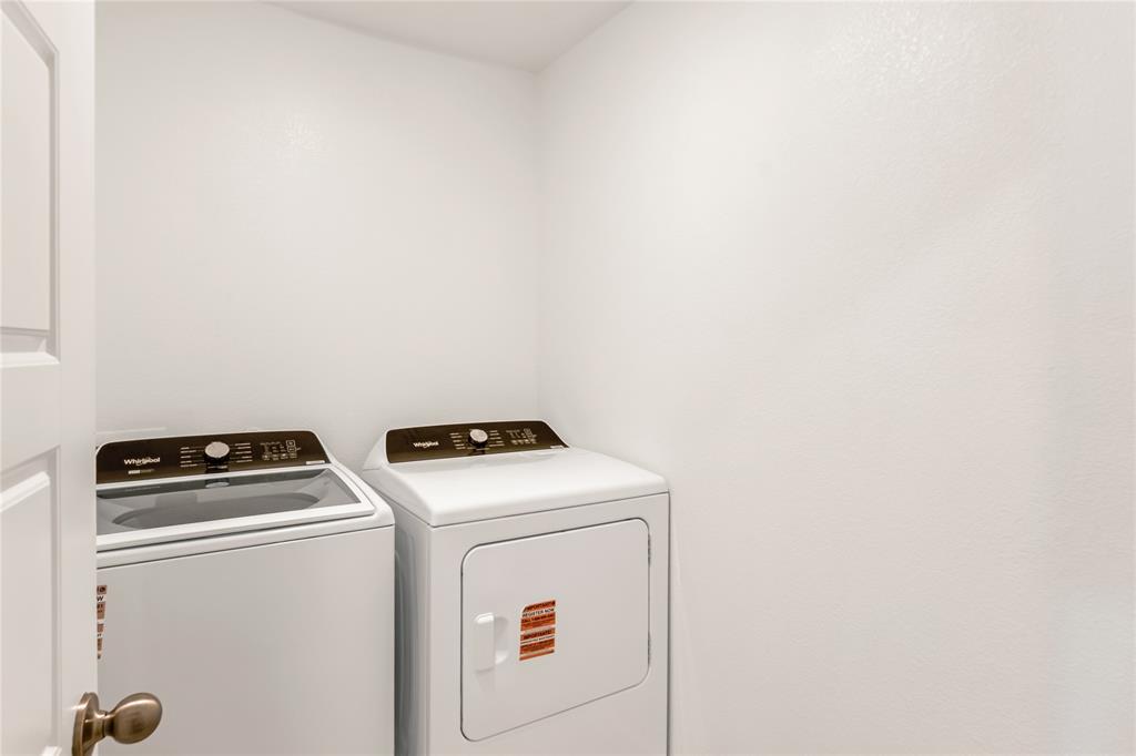 3137 Pecan Farm Lane Fort Worth, TX 76140 - Photo 17 of 31 a utility room with dryer and washer