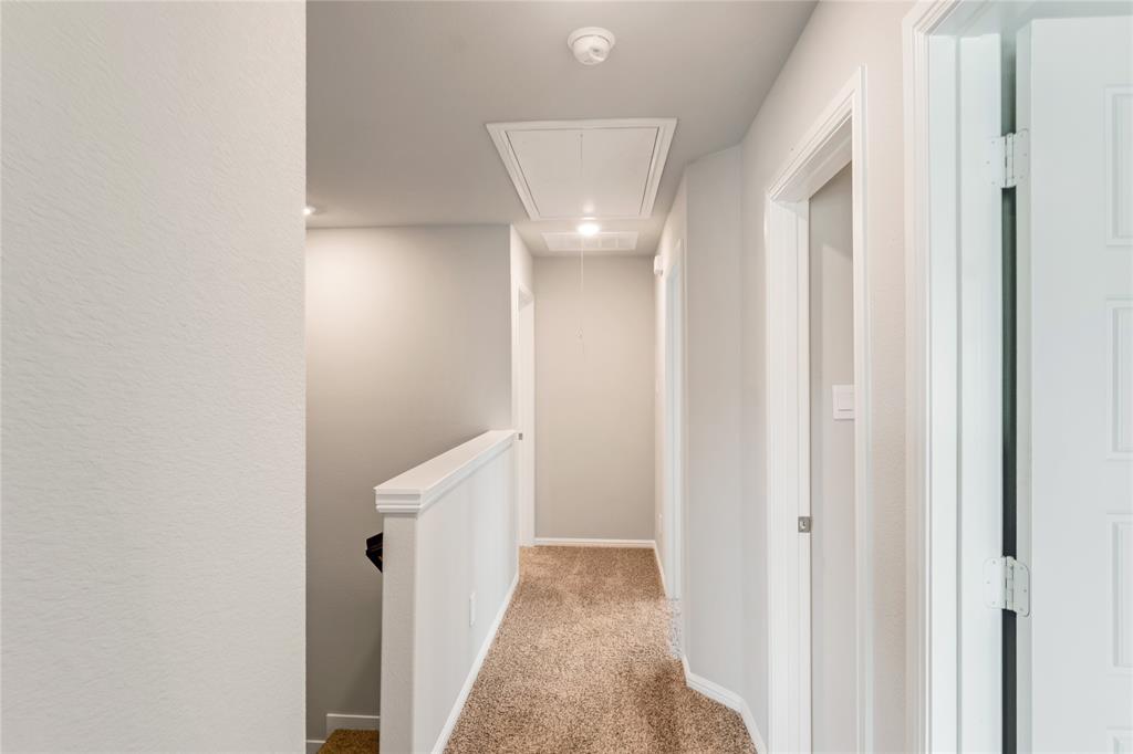 3137 Pecan Farm Lane Fort Worth, TX 76140 - Photo 8 of 31 a view of a hallway with a white walls
