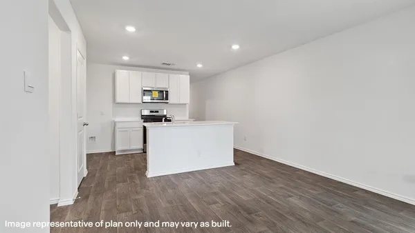 a view of a kitchen with wooden floor and a sink