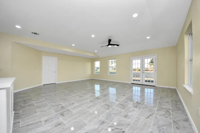 a view of a kitchen with a sink and cabinets