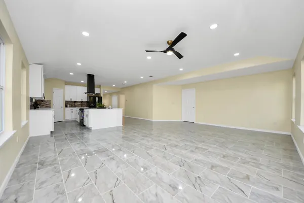 a view of a kitchen with a sink and cabinets