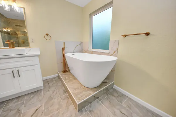 a bathroom with a sink and mirror