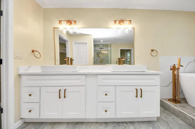 a view of walk in closet with white walls