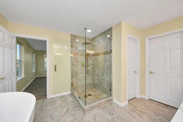 a bathroom with a shower and a sink