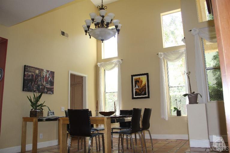 11212 Terraceridge Road Moorpark, CA 93021 - Photo 3 of 26 a view of a dining room with furniture and a chandelier