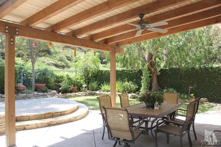 11212 Terraceridge Road Moorpark, CA 93021 - Photo 23 of 26 a patio with yard glass top table and chairs