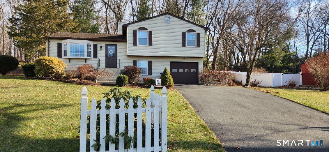 814 Graham Road South Windsor, CT 06074 - Photo 2 of 23 a front view of a house with a yard and garage
