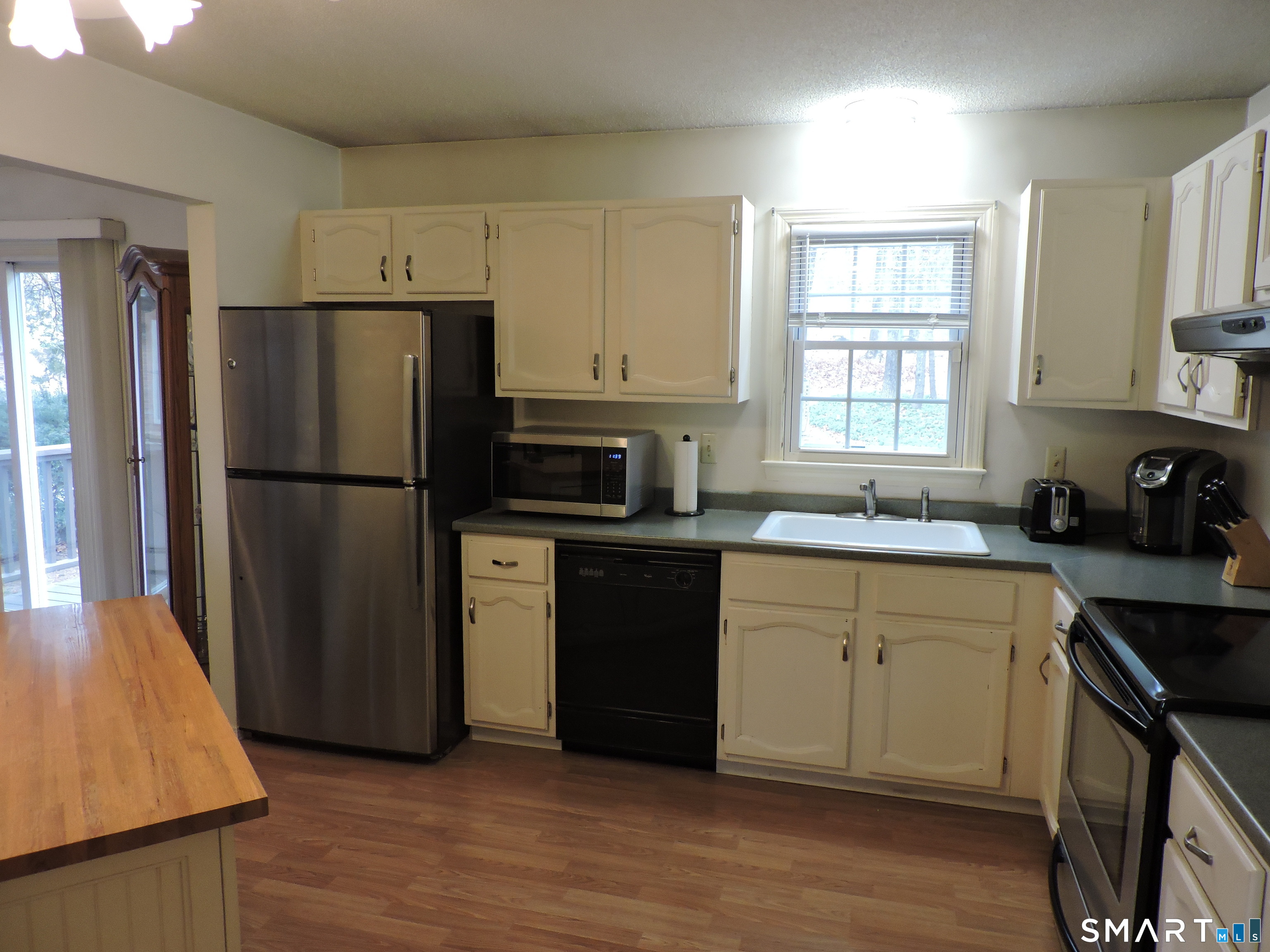 814 Graham Road South Windsor, CT 06074 - Photo 9 of 23 a kitchen with a refrigerator stove and sink