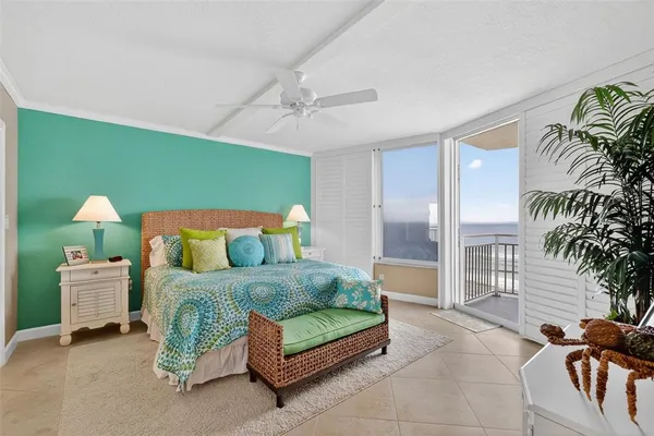 a living room with furniture a flat screen tv and a large window