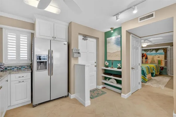 a kitchen with stainless steel appliances a stove microwave and cabinets