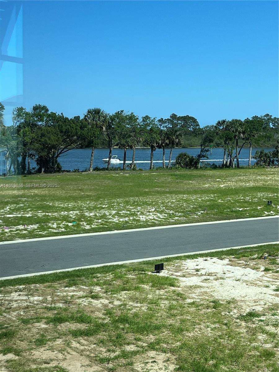129 Coronado Road Flagler Beach, FL 32136 - Photo 6 of 15 a view of a swimming pool and a yard