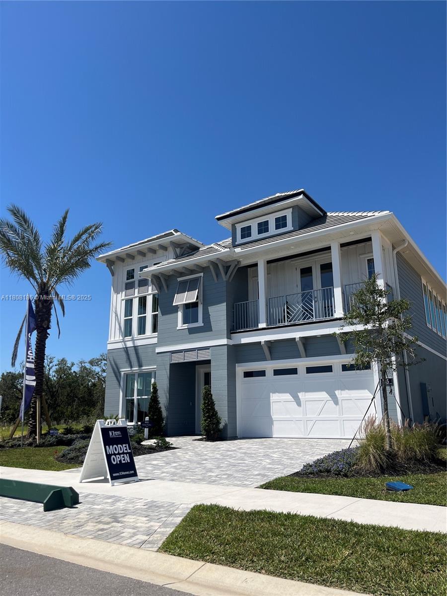 129 Coronado Road Flagler Beach, FL 32136 - Photo 8 of 15 a front view of a house with a yard