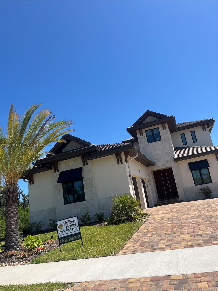 129 Coronado Road Flagler Beach, FL 32136 - Photo 10 of 15 a front view of a house with garden