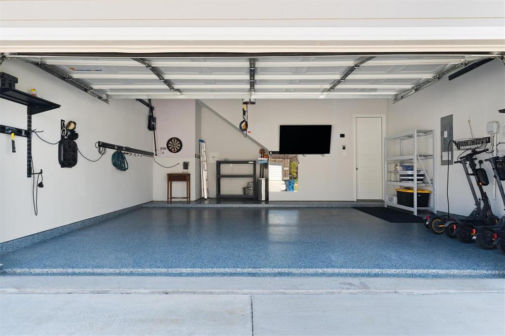 7309 Sunset Boulevard Rowlett, TX 75088 - Photo 37 of 40 Rear access garage with epoxy floor coating and plenty of storage!