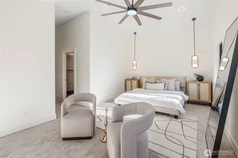 a bedroom with bed and window