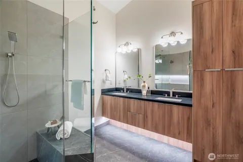 a bathroom with a shower and toilet