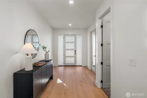 a view of a hallway with front door