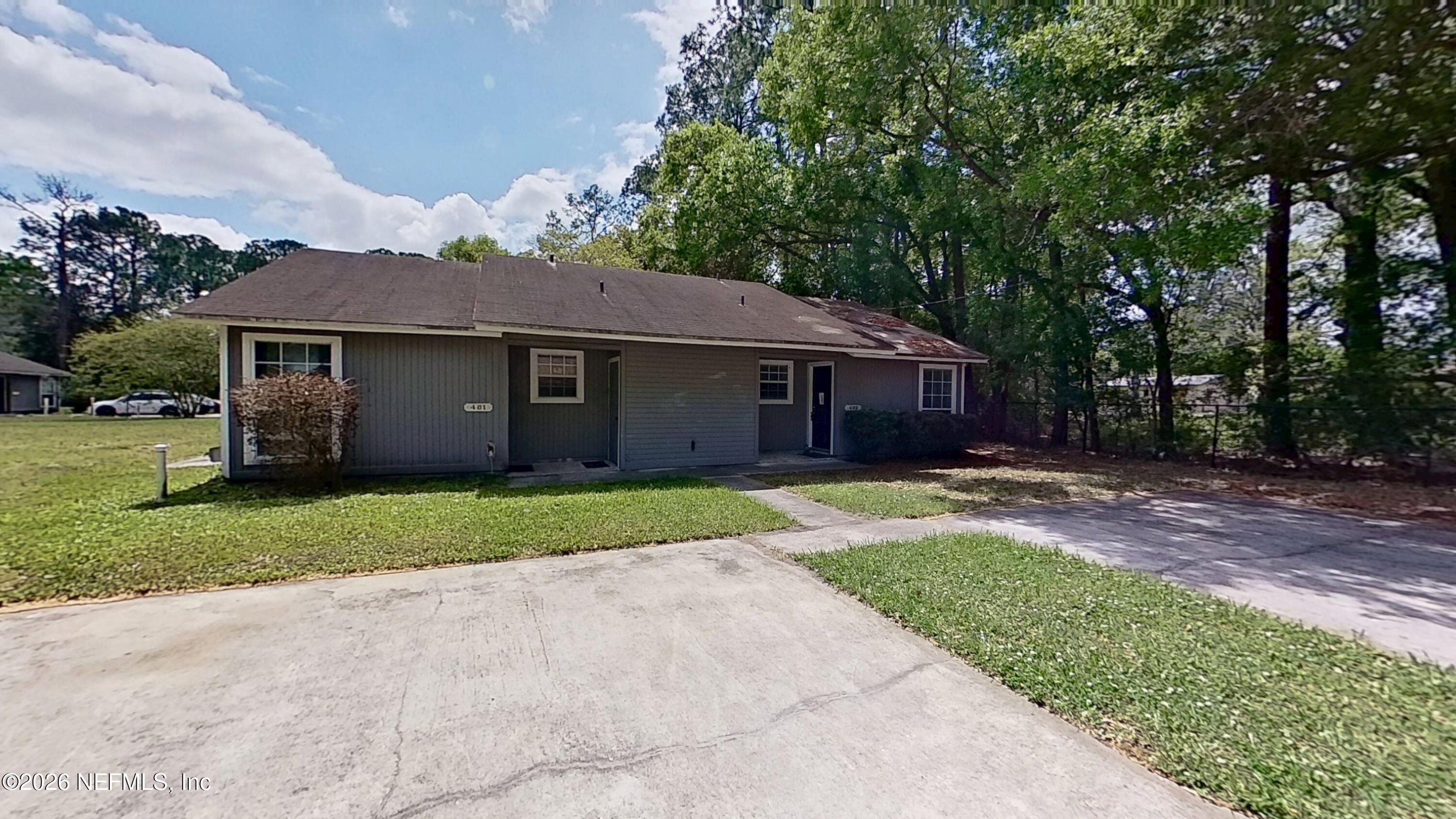 1130 Comanche Street, Unit 401 Jacksonville, FL 32205 - Photo 1 of 9 a view of a house with a yard