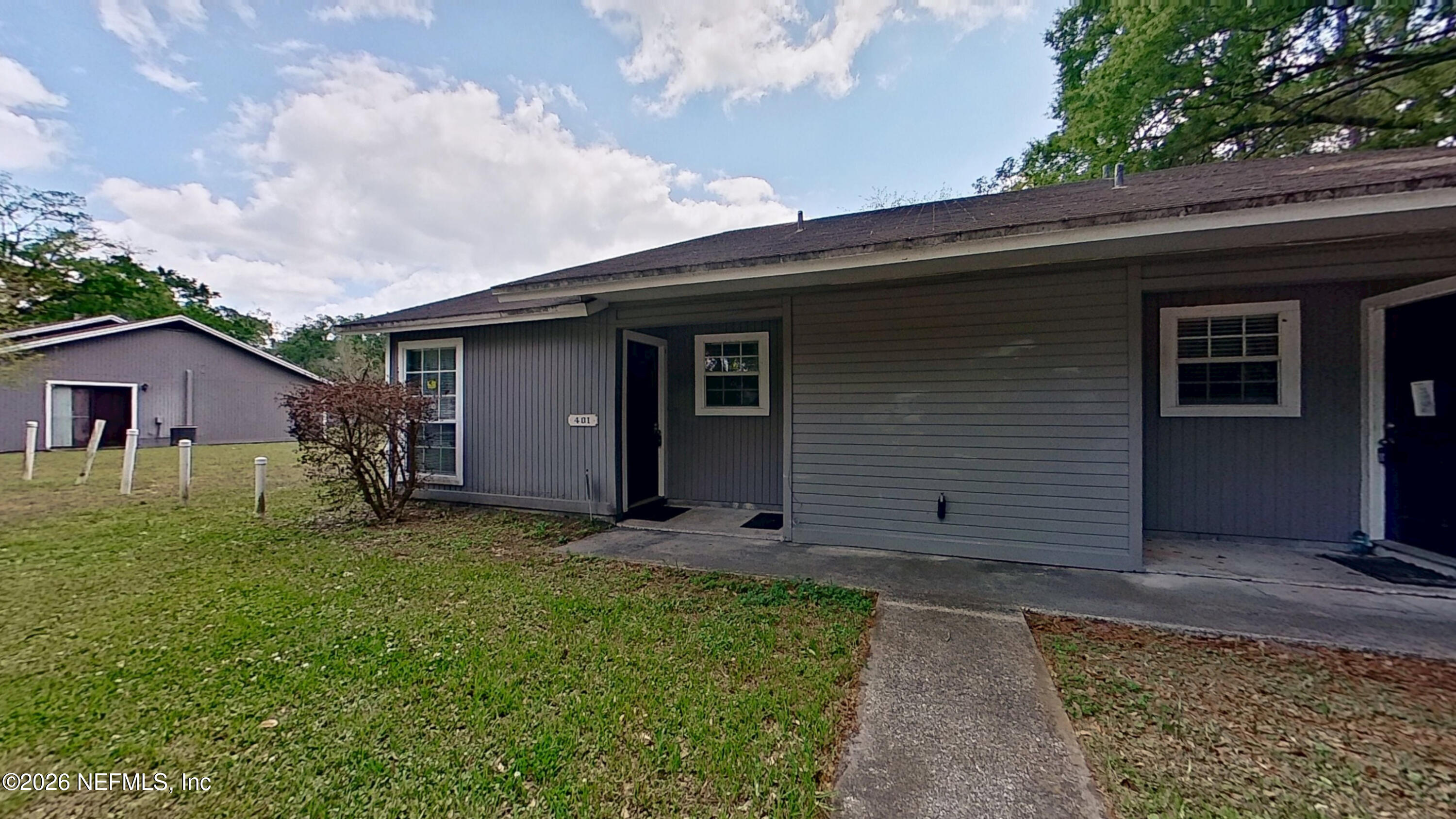 1130 Comanche Street, Unit 401 Jacksonville, FL 32205 - Photo 2 of 9 a view of a house with backyard and garden