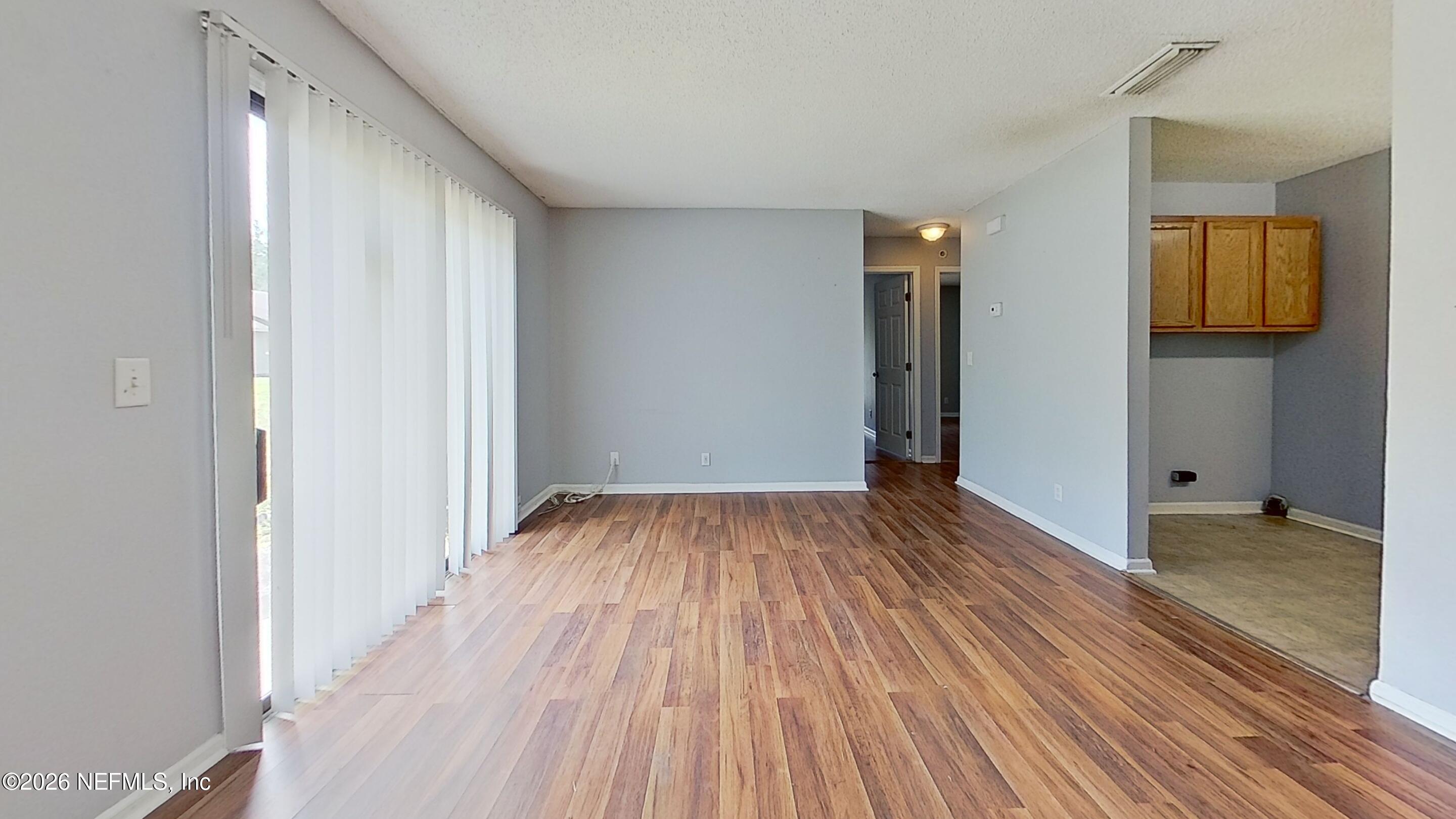 1130 Comanche Street, Unit 401 Jacksonville, FL 32205 - Photo 4 of 9 a view of a room with wooden floor and stairs