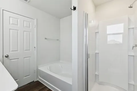 a bathroom with a tub and a shower