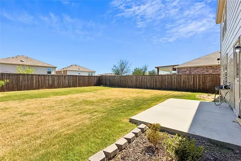 a swimming pool with wooden fence