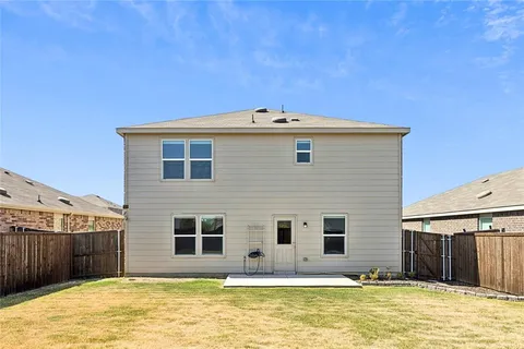 a front view of a house with a swimming pool
