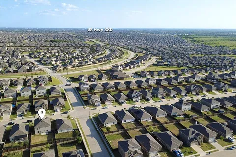 an aerial view of a house with a swimming pool