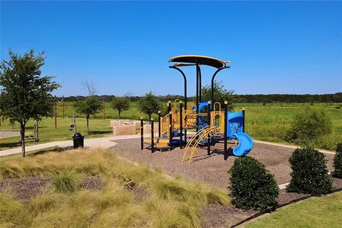 a view of a swimming pool and an outdoor seating