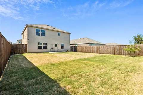 a swimming pool with wooden fence