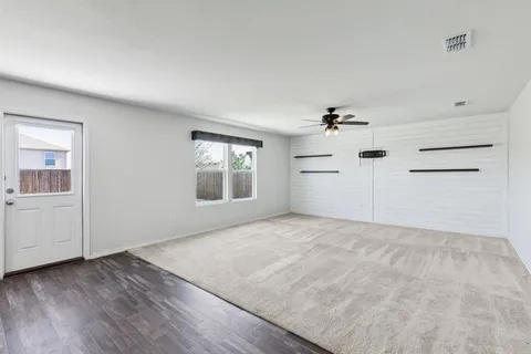 a view of a kitchen with storage and utility room