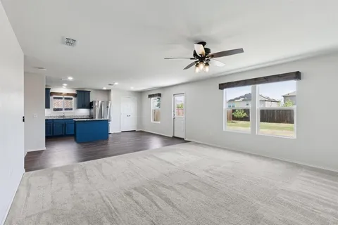 a view of a livingroom with furniture and windows