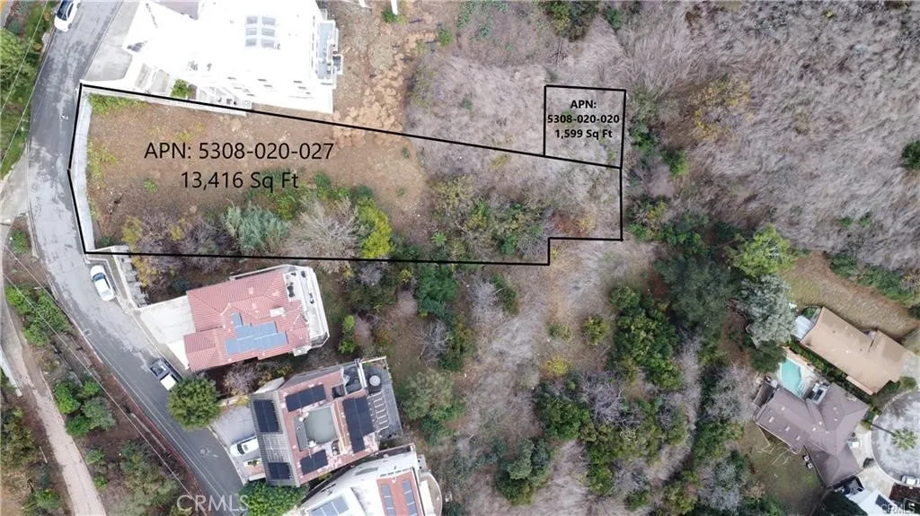 an aerial view of houses with street