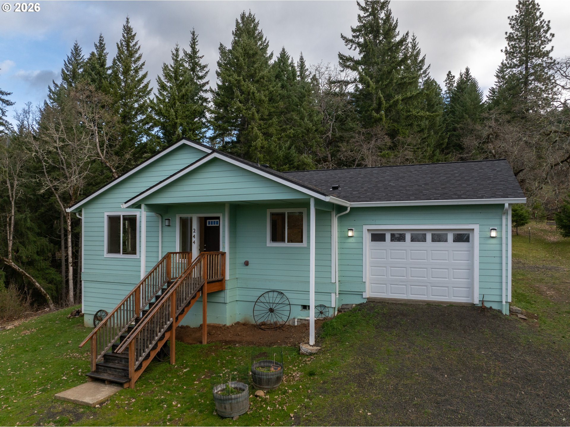 a front view of house with yard and green space