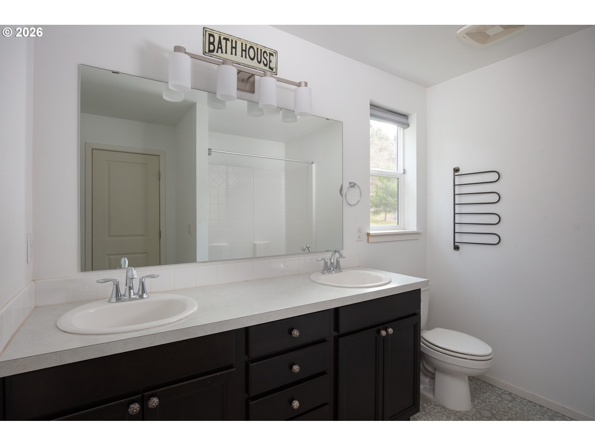 244 Lyons Road White Salmon, WA 98672 - Photo 10 of 22 a bathroom with a granite countertop sink a toilet and a mirror