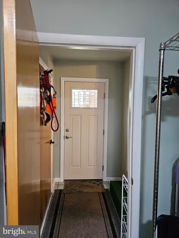 a room with furniture and a mirror