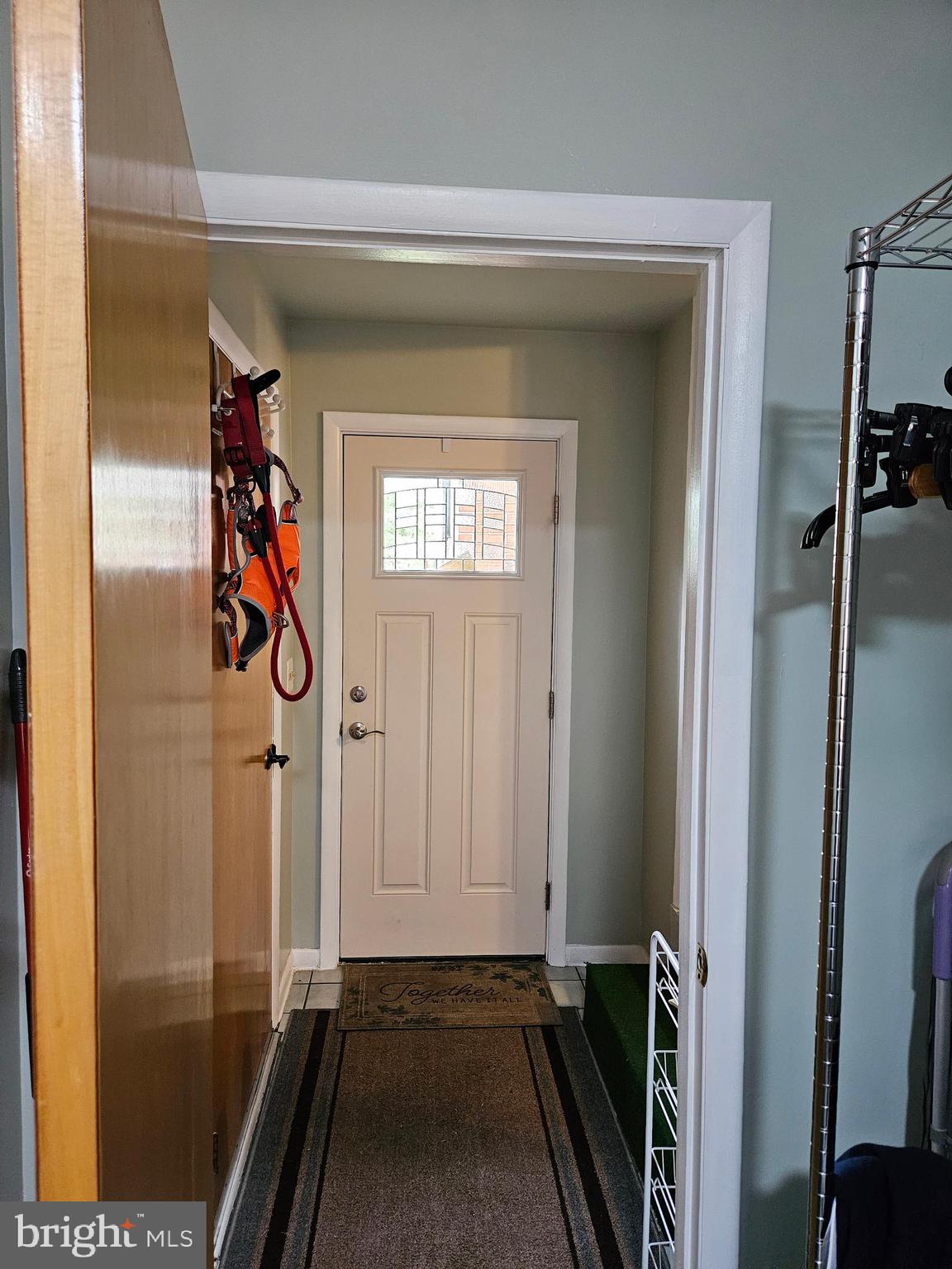1115 Bishop Walsh Road Cumberland, MD 21502 - Photo 16 of 44 a view of a hallway with wooden floor and stairs