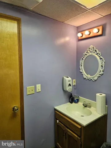 a bedroom with a bed window and dresser