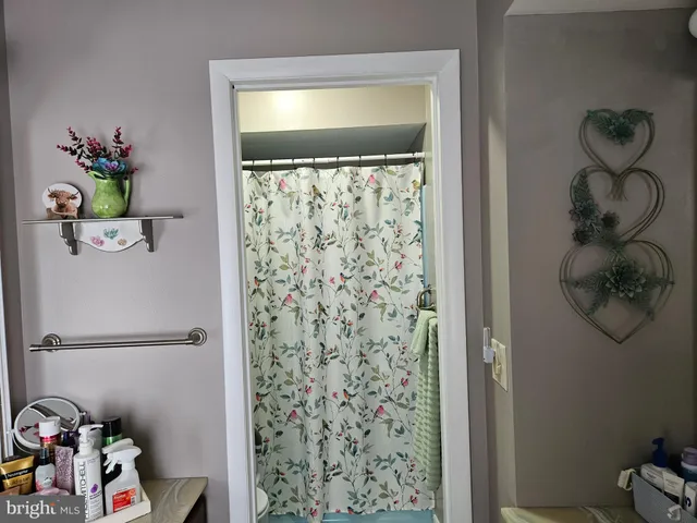 a large bathroom with a large tub and sink