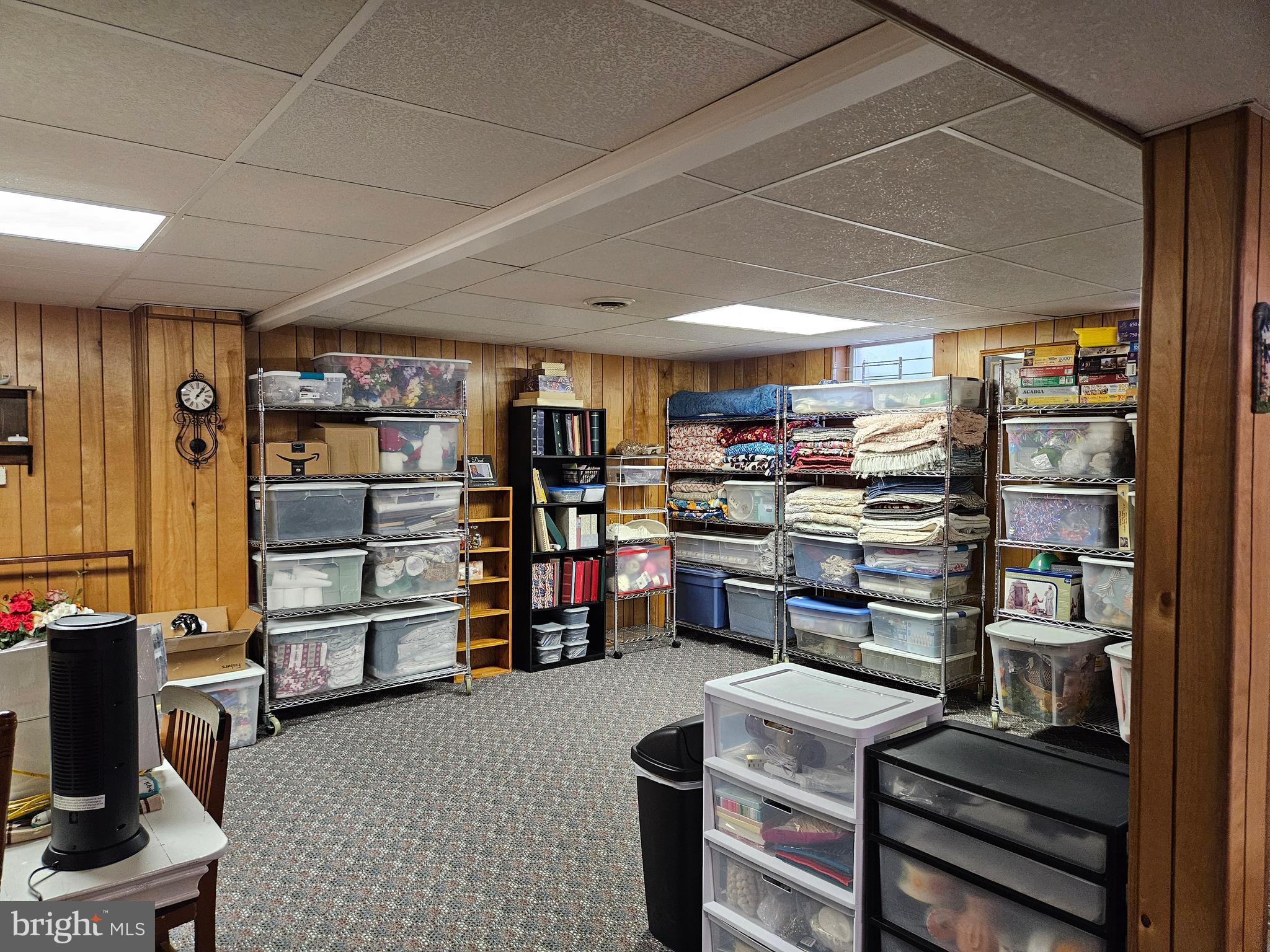 1115 Bishop Walsh Road Cumberland, MD 21502 - Photo 33 of 44 a room with lots of furniture and a book shelf