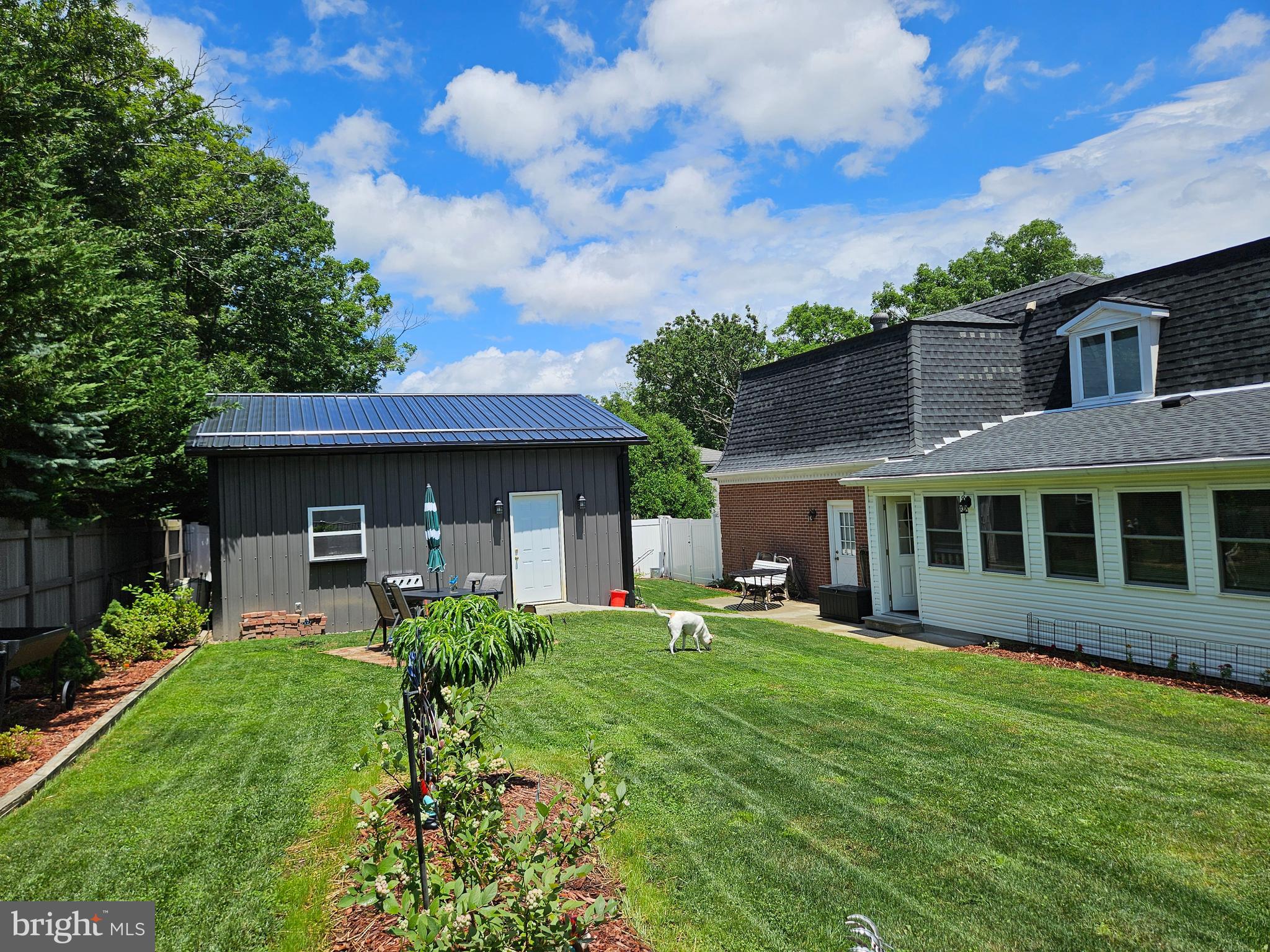 1115 Bishop Walsh Road Cumberland, MD 21502 - Photo 39 of 44 a view of a brick house with a yard and potted plants