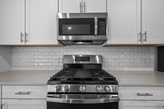 a kitchen with a sink and a refrigerator