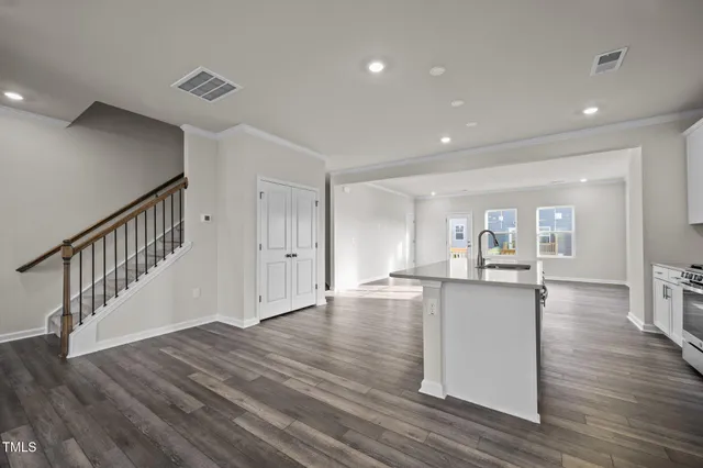 a view of kitchen with furniture and wooden floor