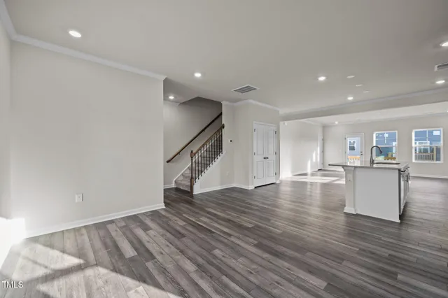 a view of an entryway with wooden floor