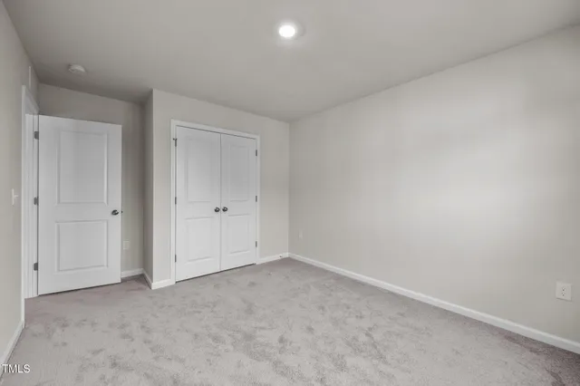 a view of an empty room and a window